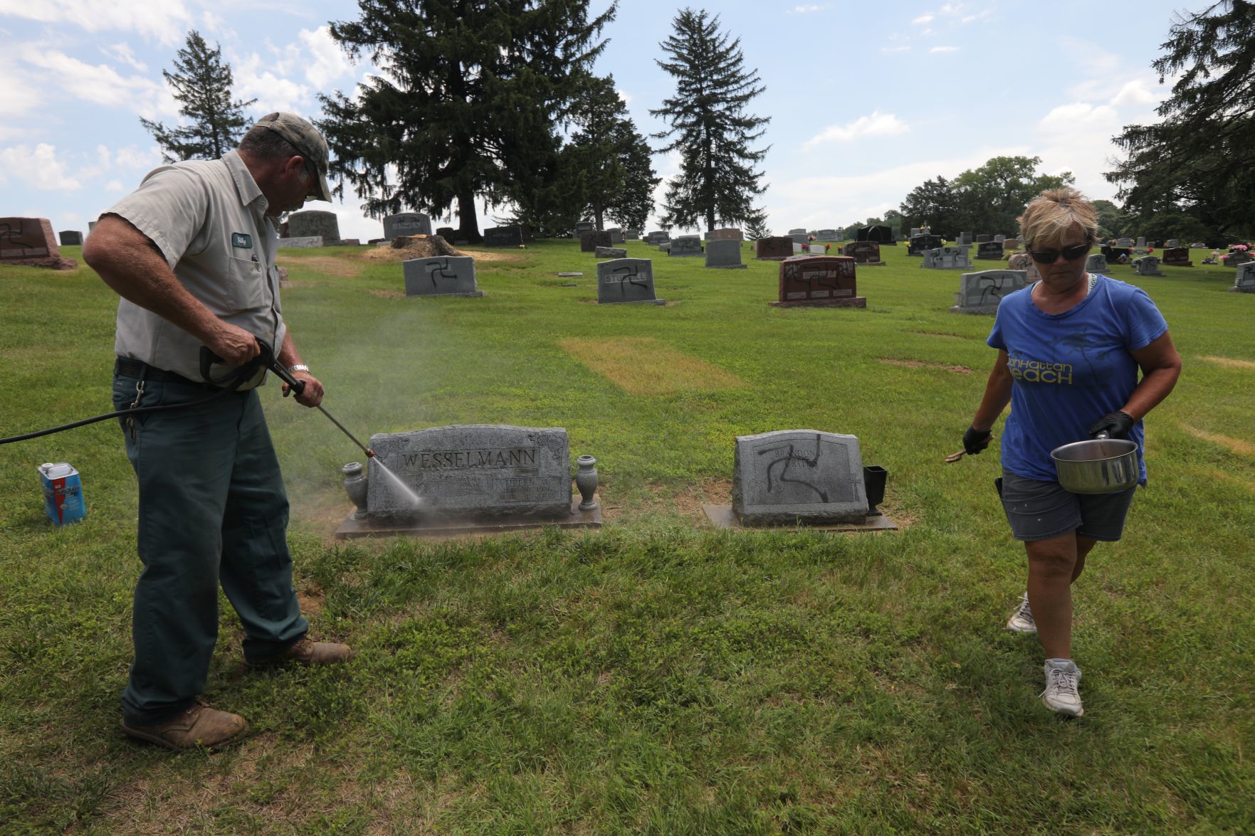 Vandal spray-paints swastikas 150 to 200 headstones and markers